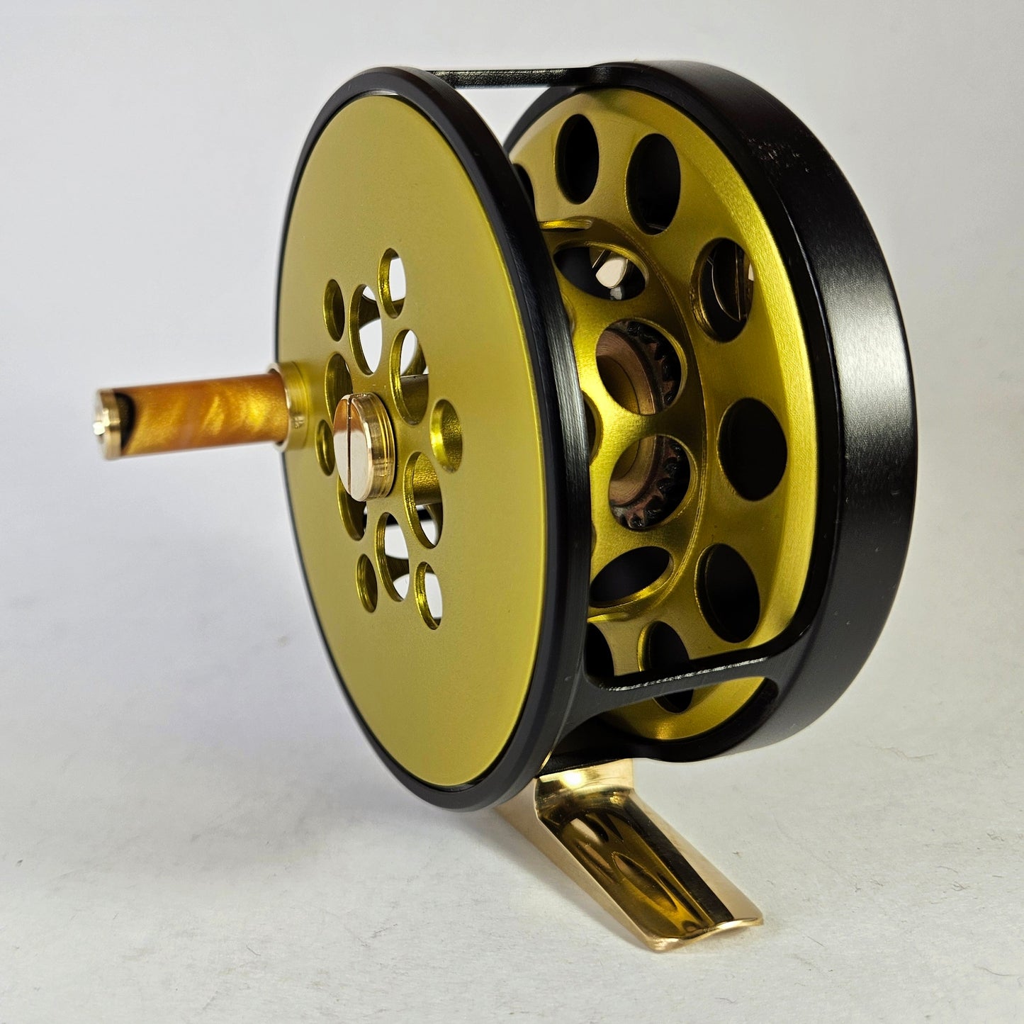 #4 Black and yellow full cage fly reel.