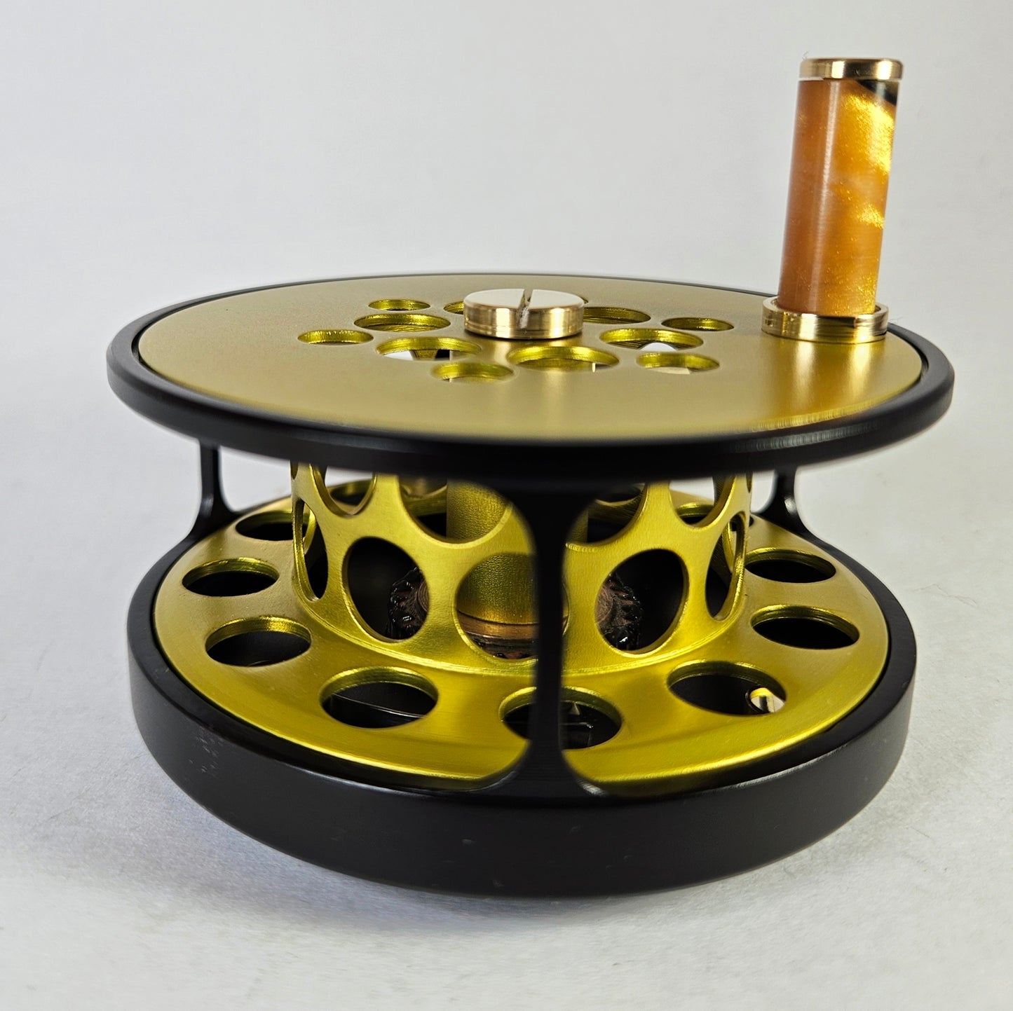 #4 Black and yellow full cage fly reel.